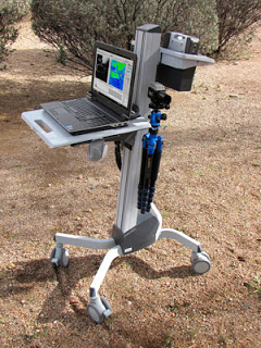 PolarCam mobile rig showing laptop computer, battery, tripod and cart.
